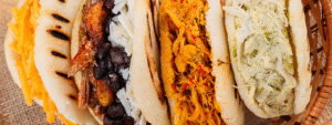 La arepa venezolana: Con queso, de pabellón, con pollo y Reina pepeada